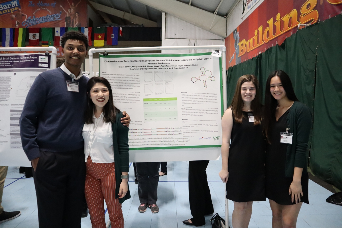 UNT PHAGES students presenting poster at state microbiology conference.
